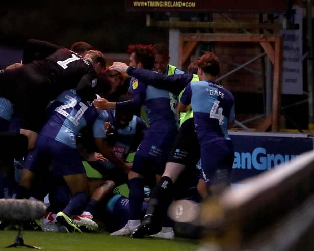 HIGH WYCOMBE, ENGLAND - JULY 06: Wycombe Wanderers celebrate after the Sky Bet League One Play Off Semi-final 2nd Leg match between Wycombe Wanderers and Fleetwood Town at Adams Park on July 06, 2020 in High Wycombe, England. Football Stadiums around Europe remain empty due to the Coronavirus Pandemic as Government social distancing laws prohibit fans inside venues resulting in all fixtures being played behind closed doors. (Photo by Warren Little/Getty Images)
