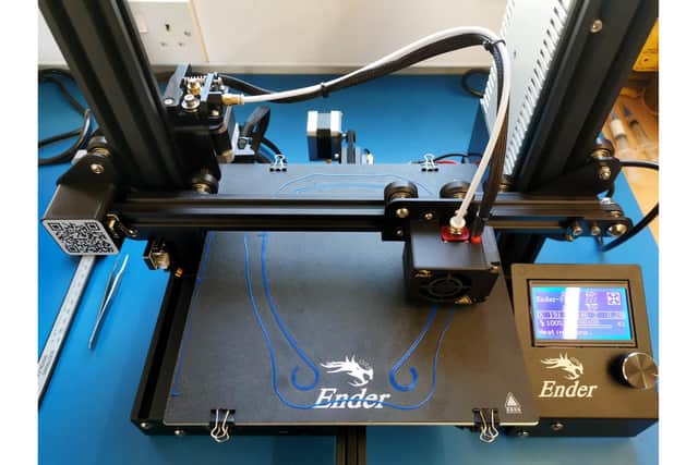 The 3D printer John Harris is using to make visors