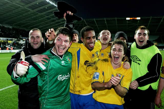 Havant & Waterlooville players celebrate after a 1-1 third round draw at three divisions higher Swansea City in January 2008. Hawks won the replay 4-2 at Westleigh Park. Photo by Richard Heathcote/Getty Images.