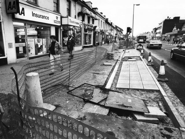 Paving work is carried out in West Street in Fareham in December 1990