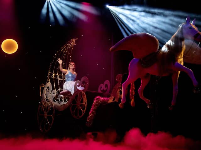 Cinderella (Emily Day) rides the magical coach