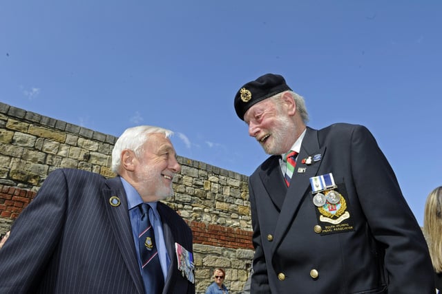 2005. HMS Sheffield remembrance service at the Falklands Memorial in Old Portsmouth.
(left), Cdr Michael Norman shares a lighter moment with Ch/TIFF Mike Smith.
Picture: Ian Hargreaves  (050519-9)