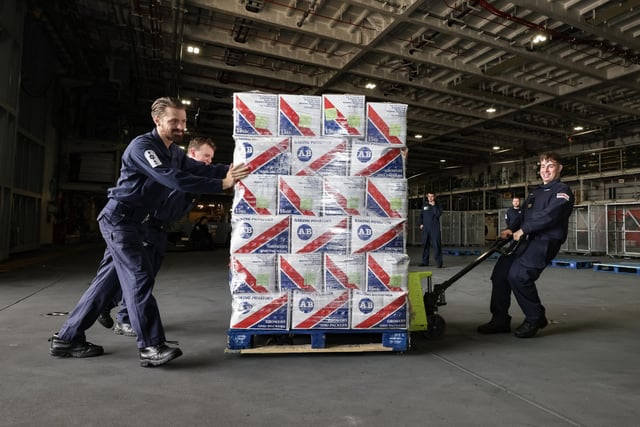 A palette of baking potatoes is loaded onto the ship.