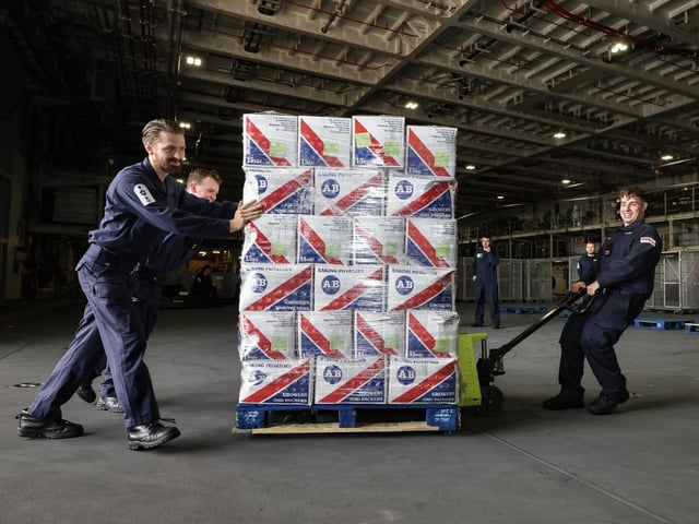 A palette of baking potatoes is loaded onto the ship.