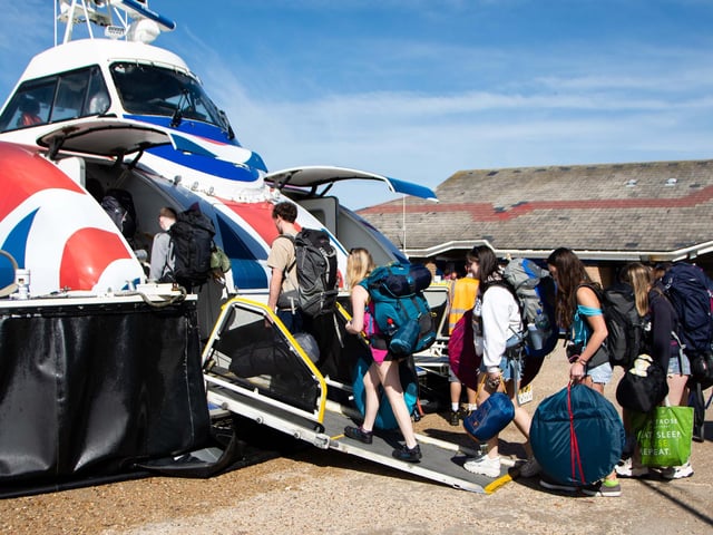 The Isle Of Wight Festival in Seaclose Park 2022. Pictured is: Festival goers board the Hovercraft. Picture: Emma Terracciano.