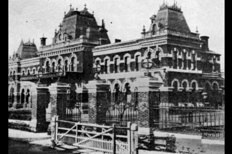 The Town Station now Portsmouth & Southsea with the level crossing across Commercial Road