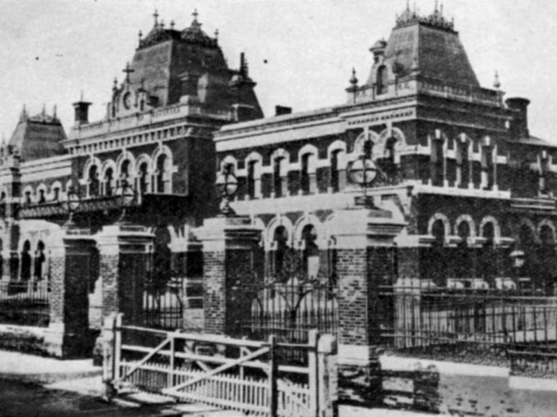 The Town Station now Portsmouth & Southsea with the level crossing across Commercial Road