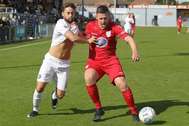 George Barker, left, in action for Hawks in an FA Cup tie against Merthyr in 2017. Picture : Habibur Rahman