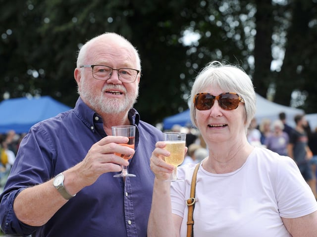 Pictured is: Peter and Carole Donnelly from Hayling Island, enjoy a glass of wine from Bush Vines  Picture: Sarah Standing (260824-5611)
