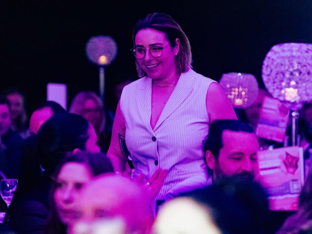 Jodie Goodchild makes her way to the stage to collect the Entrepreneur of the Year award. Picture: Keith Woodland (270321-210)