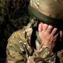 Systemic failings in the NHS are  leading to lengthy delays in treating suicidal veterans, MPs have been warned.