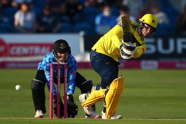 Tom Alsop of Hampshire looks to hit out against Sussex at Hove on Saturday. Photo by Charlie Crowhurst/Getty Images.
