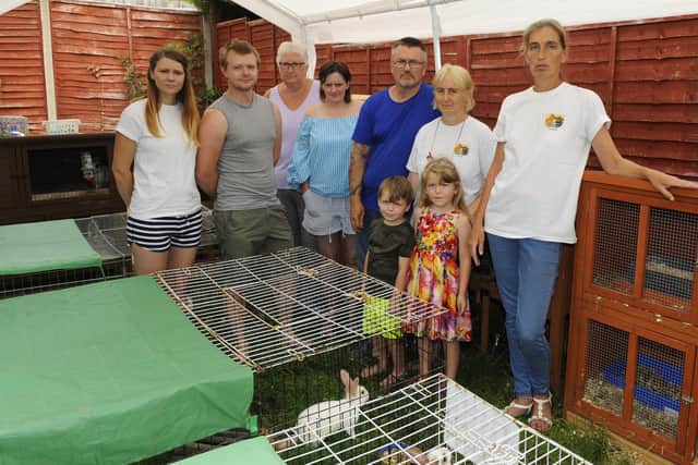 Vanessa Taylor with her friends and fellow members of South Coast Rabbit Rescue based in Paulsgrove, Portsmouth, Hampshire saved 22 rabbits from a single property earlier this week - this has now risen to 28 due to six newborns overnight! Vanessa now has 51 rabbits either abandoned or lost in her possession and has run out of space to take any more Picture: Malcolm Wells (180727-8942)