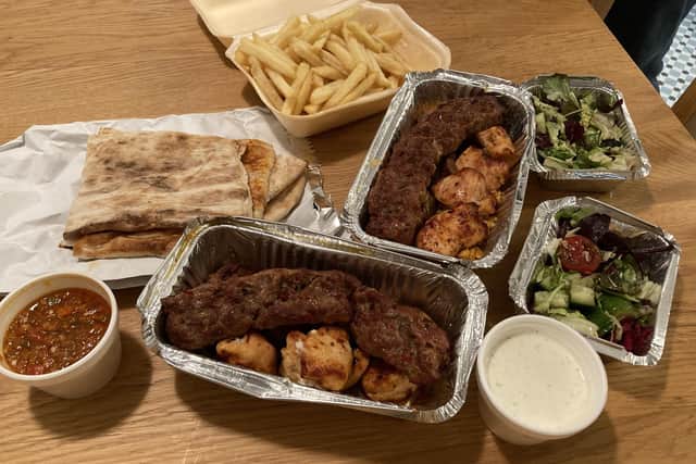 The two kebabs, chips and couscous.