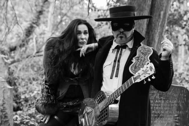 Paul-Ronney Angel and Tomi Rae Brown play among the graves... Picture by Josie Beth-Davies
