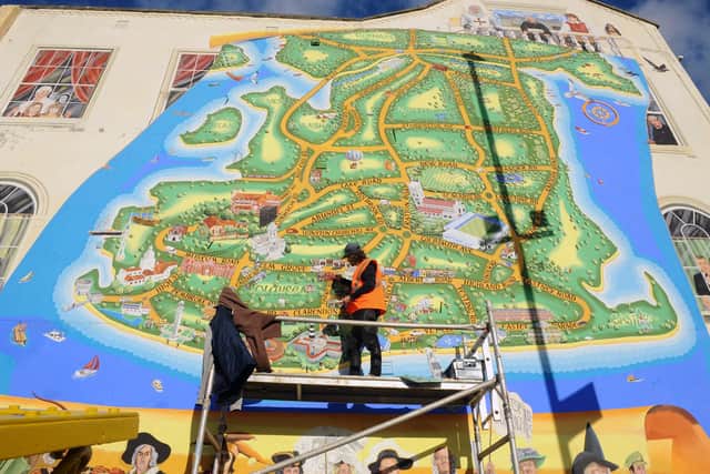 Artist Mark Lewis adding more to his ever growing mural on the junction of Waverley Road and Clarendon Road in Southsea.
Picture: Sarah Standing (171120-8802)