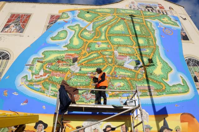 Artist Mark Lewis adding more to his ever growing mural on the junction of Waverley Road and Clarendon Road in Southsea.

Picture: Sarah Standing (171120-8802)