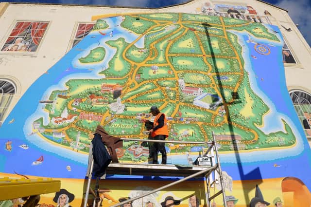Artist Mark Lewis adding more to his ever growing mural on the junction of Waverley Road and Clarendon Road in Southsea.
Picture: Sarah Standing (171120-8802)