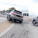 Toyota parks on top of bollard outside Fareham train station.