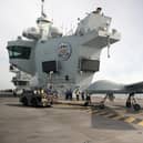 Pictured: Mojave aircraft is taken back into the hanger after a successful trail on HMS Prince of Wales. 

Pic: RN