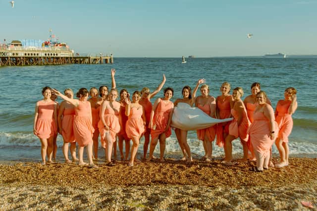 The 17 bridesmaids on the beach. Picture: Tegan McCann