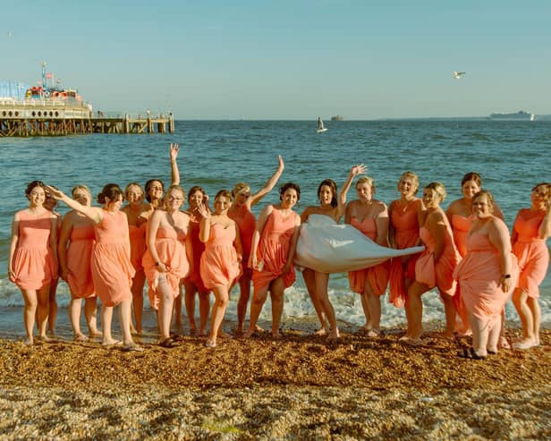 The 17 bridesmaids on the beach. Picture: Tegan McCann