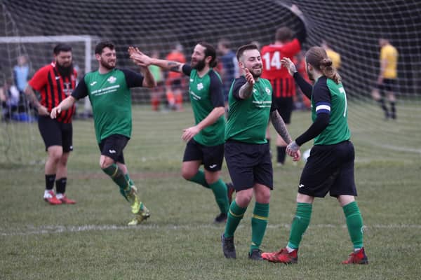 Saturn Royale celebrate one of their four goals. Picture: Stuart Martin