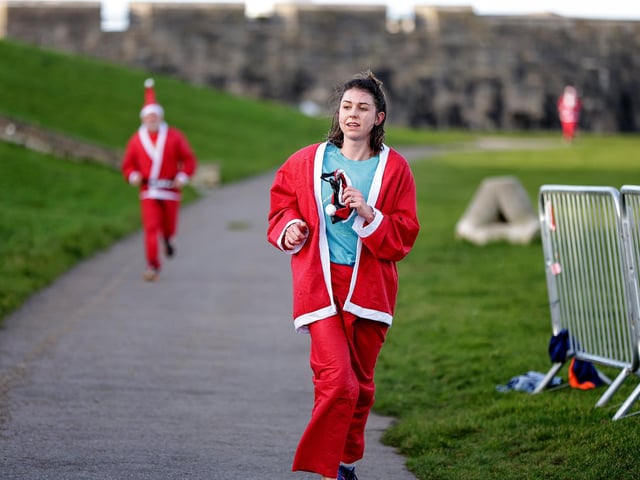 A number of runners took to the picturesque coastal route to take on the Portsmouth Coastal Waterside Marathon, Festive Half Marathon, as well as the Southsea 5k and 10k Turkey Trot. Picture: Chris Moorhouse (221224-71)