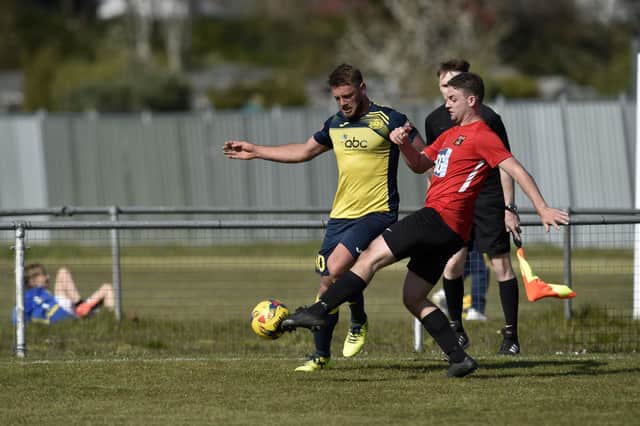 Steve Hutchings, left, netted two first half penalties as Moneyfields defeated Totton & Eling 4-0 in the FA Vase. Picture: Allan Hutchings