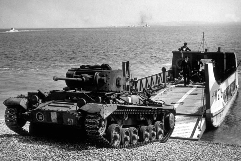 1943:  A Valentine tank climbs the beach after leaving the landing craft during an invasion exercise in the run-up to D-Day.  (Photo by Fox Photos/Getty Images)