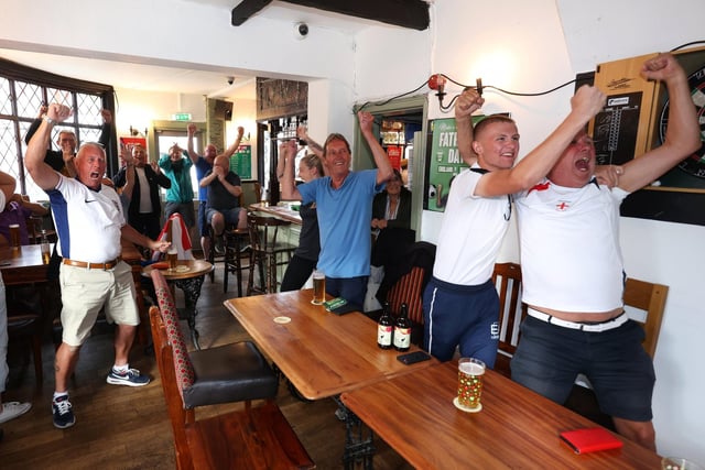 Fans in The Milton Arms Pub celebrate in disbelief as England scrape through to the quarter finals after extra time.Picture: Sam Stephenson.