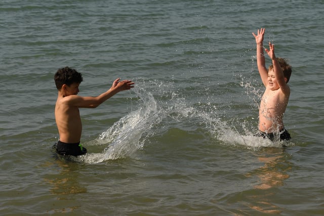 Devaun Keir and Kian Jones enjoy themselves in the sea. (160421-31)