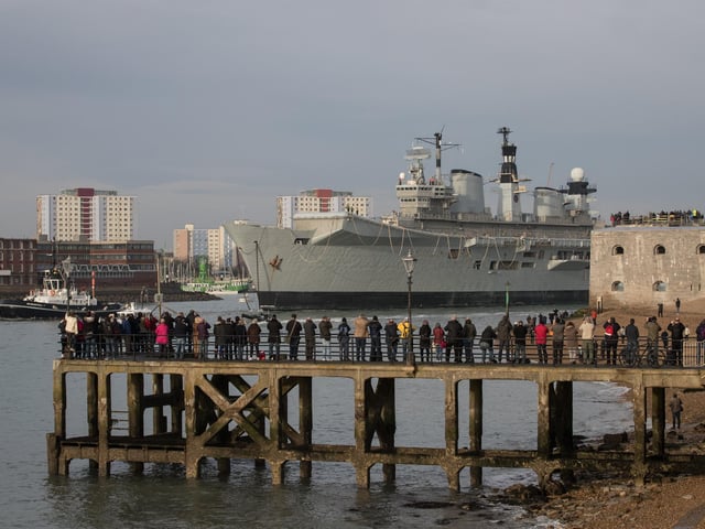 HMS Illustrious is towed from her home port at Portsmouth Docks after being sold for scrap on December 7, 2016 in Portsmouth. Photo by Matt Cardy/Getty Images