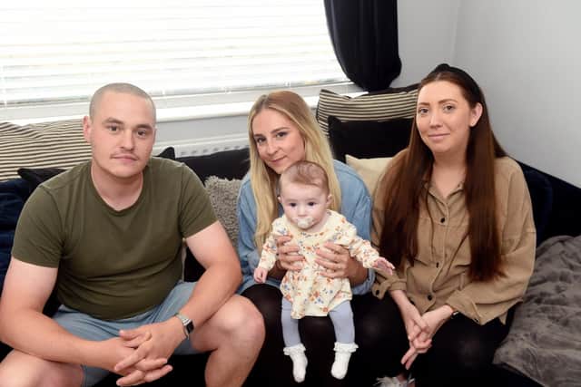 In the middle is Charlie's wife Sam Crawford (27), and their daughter Nellie (four months old) with best friends Tim Farmer (30) and Jade Bury (29) - all from Havant. Picture: Sarah Standing (240522-8065)