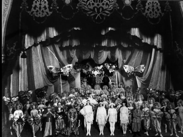 A rare image of actors on stage around 1920-25. The cast of Aladdin.