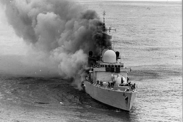 HMS Sheffield ablaze after being hit by an Argentine Exocet missile during the Falklands War