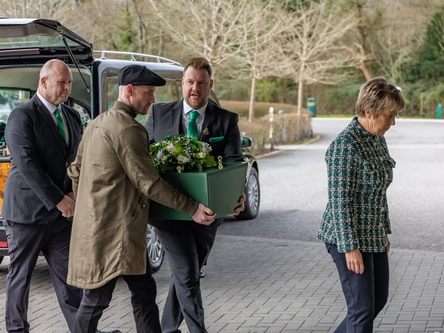 Baby Jax is carried indoors by father Lee Merritt and friend Dale. Picture: Mike Cooter (160324)