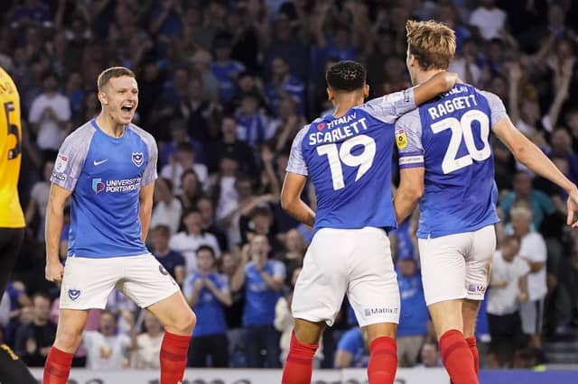 Pompey celebrate Colby Bishop's fifth goal of the season during Pompey's 4-1 win against Cambridge United Picture: Jason Brown.