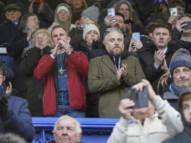 Keeping dry in the stands.