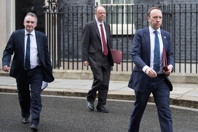 Health Secretary Matt Hancock (right), and Chief Medical Officer Chris Whitty (centre) leaving the Cabinet Office in London, after a meeting of the Government's emergency committee Cobra to discuss coronavirus. PA Photo: Stefan Rousseau/PA Wire