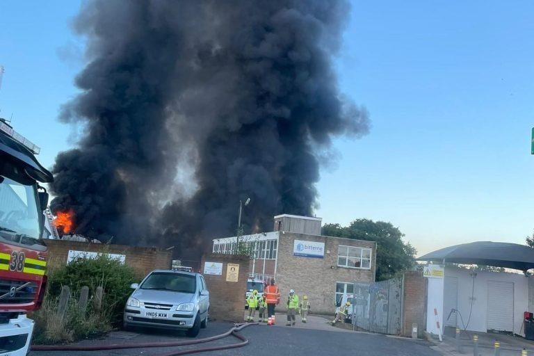 More than 80 firefighters were deployed to tackle a ferocious garage fire, which spread to nearby vehicles and buildings. Smoke could be seen filling the sky.