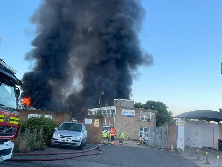 More than 80 firefighters were deployed to tackle a ferocious garage fire, which spread to nearby vehicles and buildings. Smoke could be seen filling the sky.