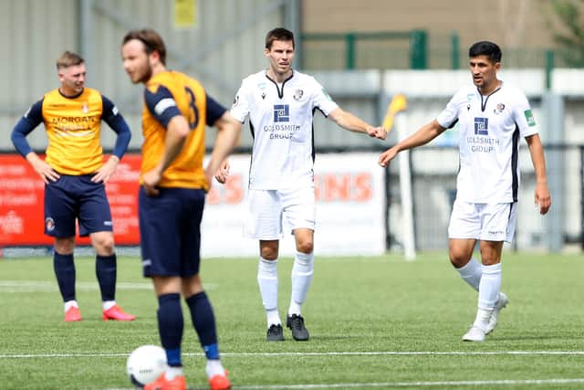 Charlie Sheringham (middle) is congratulated by  Noor Husin after scoring his second goal for Dartford at Slough. Photo by Warren Little/Getty Images.