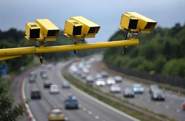 File photo from 2015 of three SPECS Average Speed cameras in position on the M3 motorway in Hampshire. Picture: Andrew Matthews/PA Wire