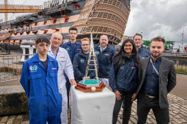Apprentices of BAE systems and Hythe Marina Alfie Westrope, Darren McKell, Callum Williams, George Clayton, Lee White, Cimi Atwal, Robert Cox
and Jordan Craven with the trophy outside HMS Victory, Portsmouth
Picture: Habibur Rahman