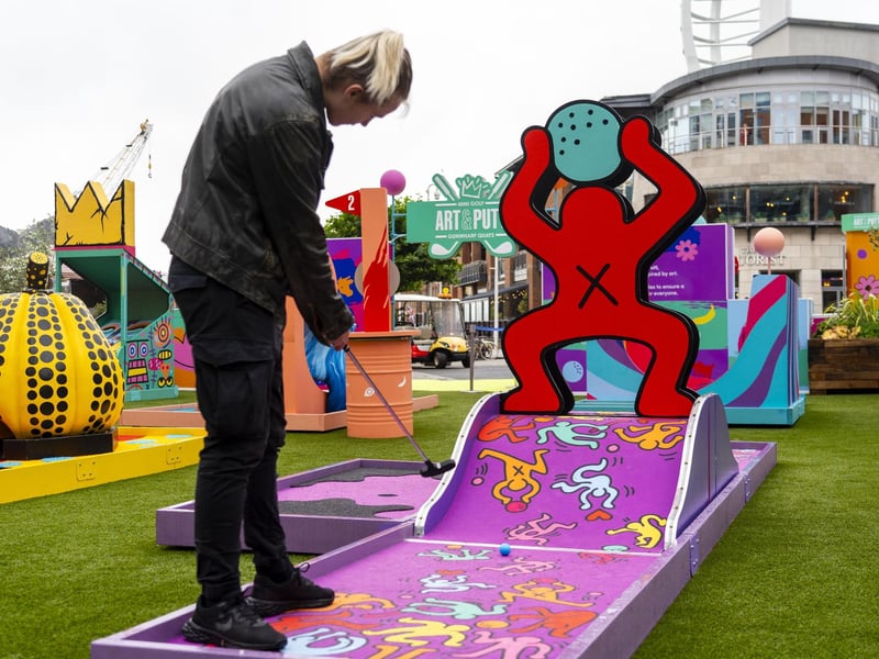 The new Art & Putt site has proved popular with Gunwharf Quays visitors - so much so that people have even enjoyied a game of mini golf in the rain. Picture: Matthew Clark