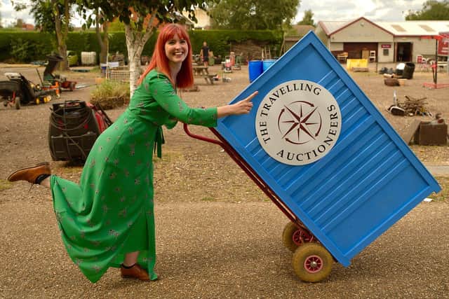 Izzy Balmer with the roll-in rostrum featured in The Travelling Auctioneers