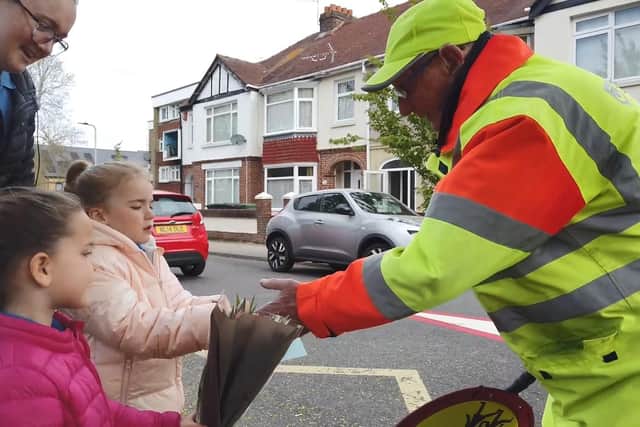 Nursery children from The Parade Community Preschool in Portsmouth give lollipop man Dennis Hogger a present