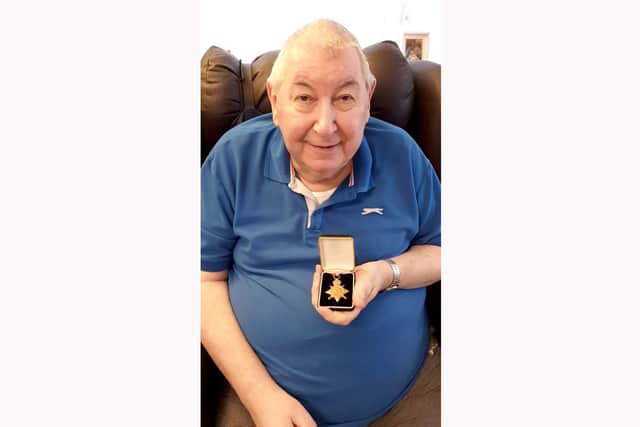 Brian Bowley Nicolson, 81, after being reunited with his grandfather's First World War medal which was found in a garden in Waterlooville.