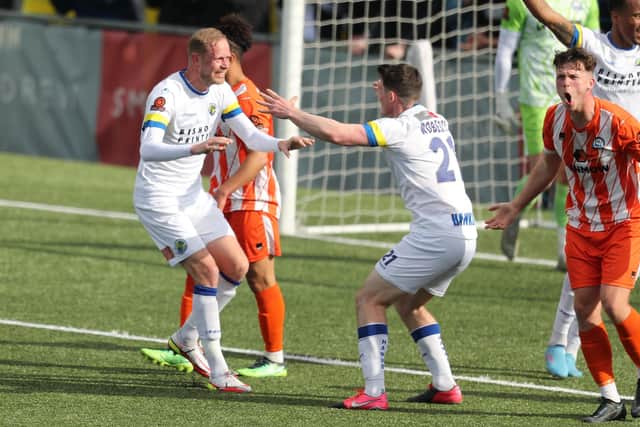 Scott Rendell, left, celebrates with team-mate James Roberts after netting the fourth and final goal in the weekend win over Braintree Picture: Dave Haines